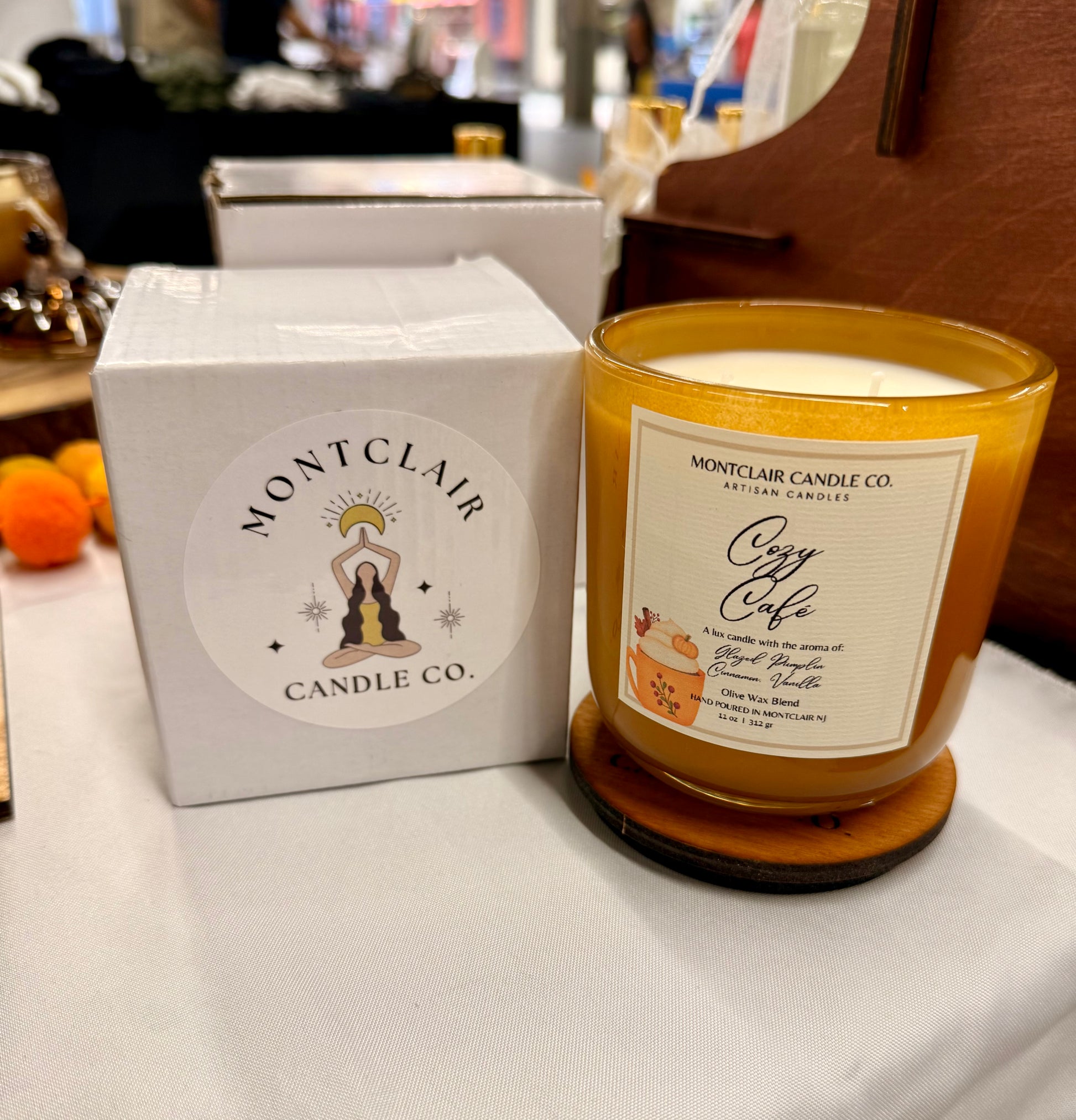 Montclair Candle Co. candle with packaging on a table