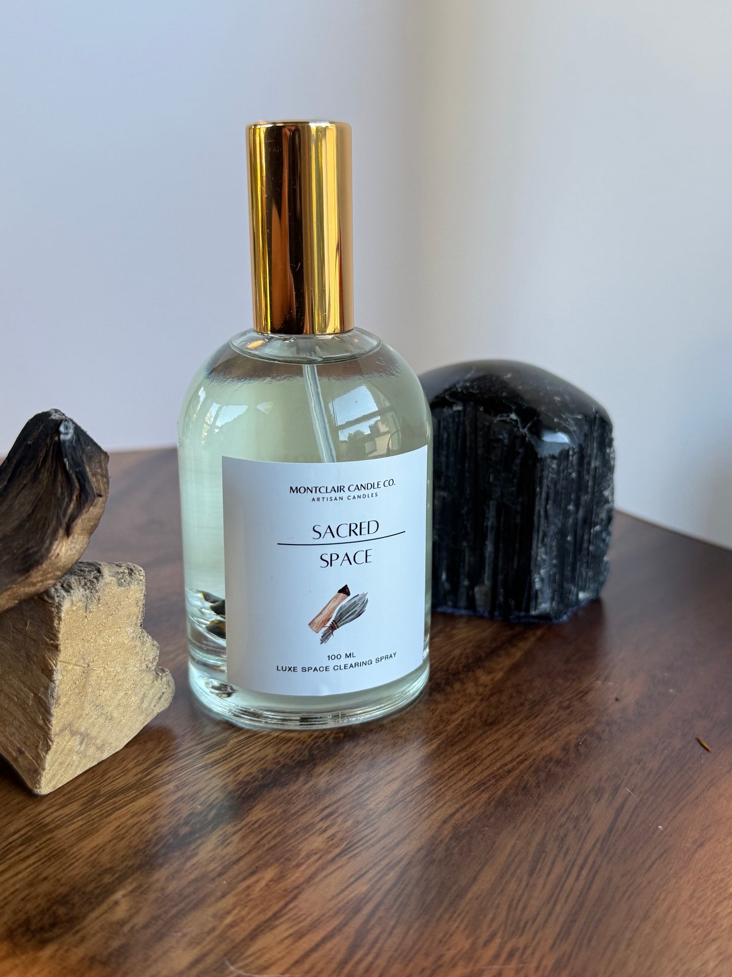 Small bottle with a gold cap on a wooden surface