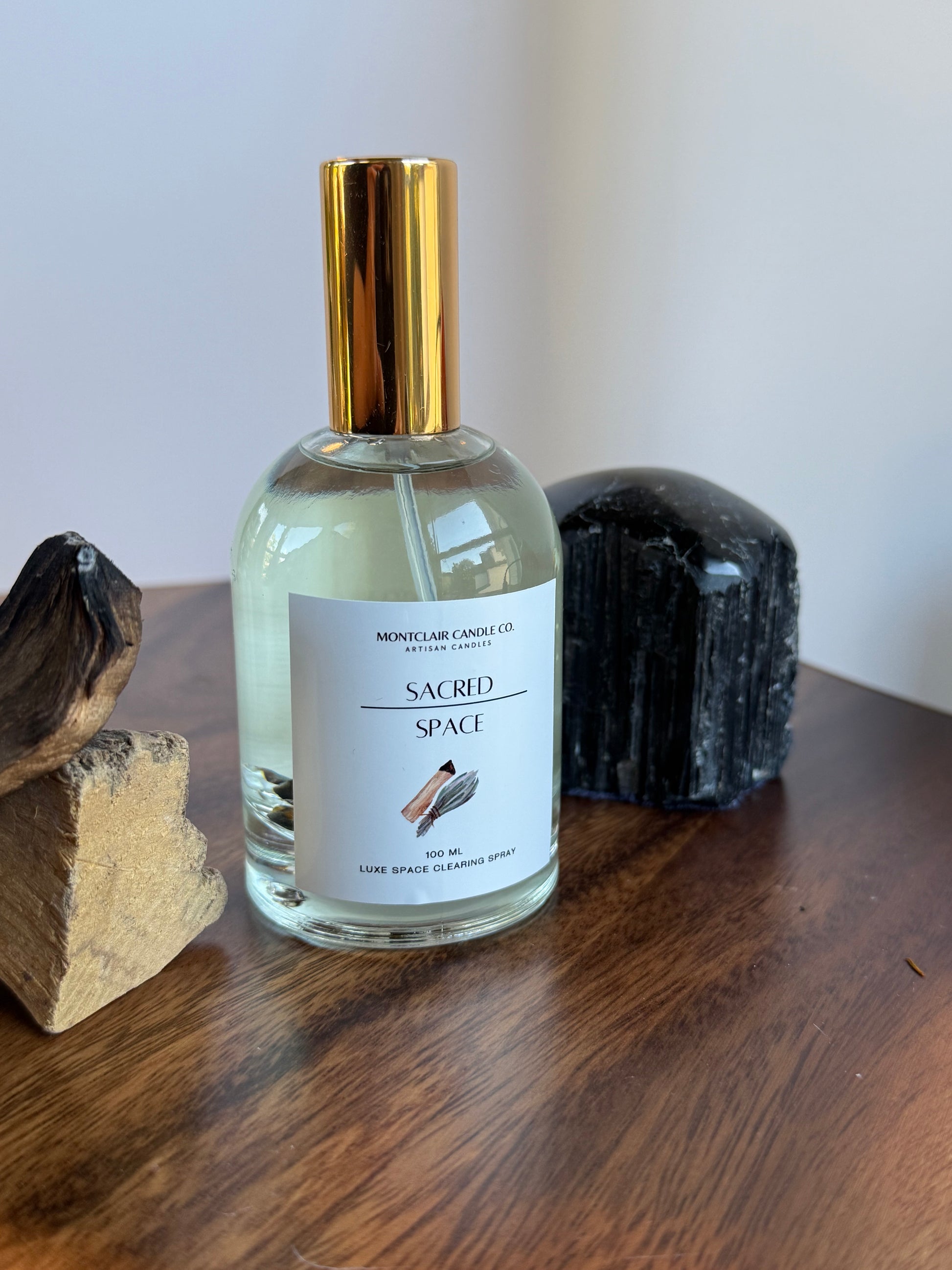 Small bottle with a gold cap on a wooden surface